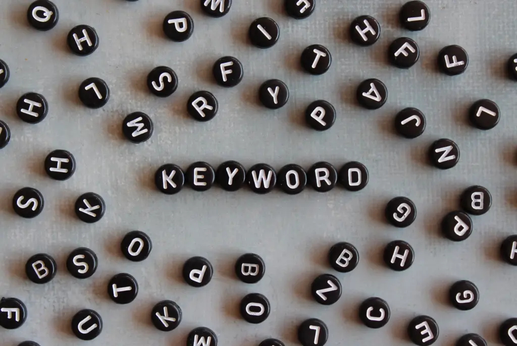 Black letter beads spelling out the word keyword, symbolizing the shift from keyword density to smarter SEO strategies in 2025.